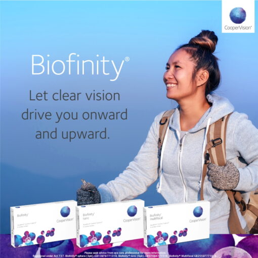 A woman smiling with a backpack wearing CooperVision Biofinity Monthly Lenses